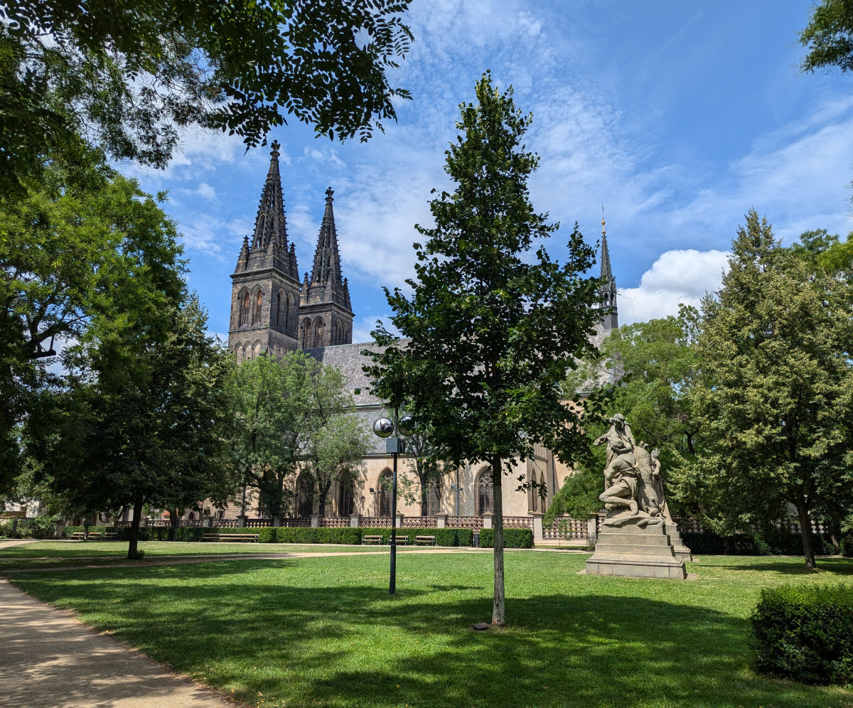 The absolutely stunning church over the green space